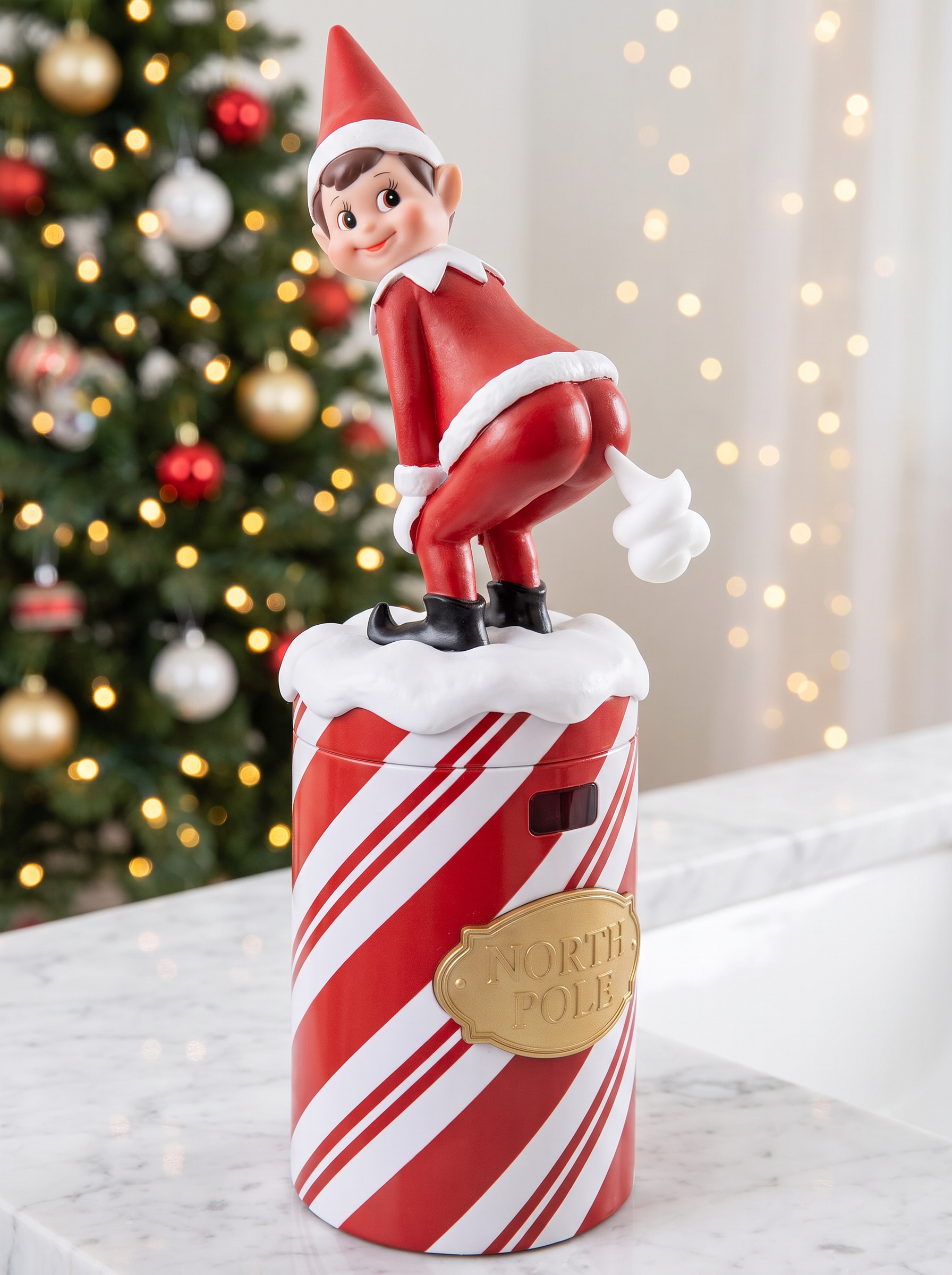 Elf Suds Soap Dispenser front view with candy-cane body and elf on top